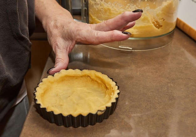 Process of making the base for Round Cream Pie with Chocolate and Strawberries French recipe