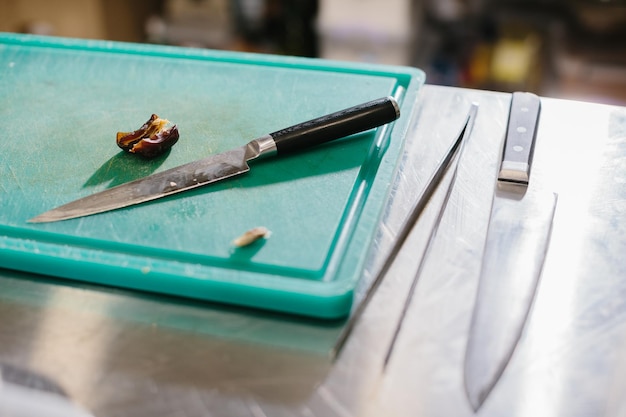 The process of making muesli in a restaurant the male chef cuts dates in the kitchen