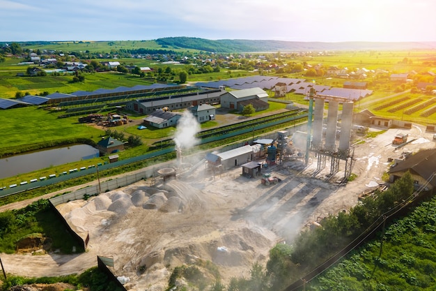 Processing factory at mining site producing cement construction materials.