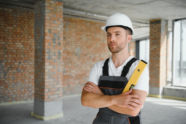 Profession construction and building male worker or builder in helmet