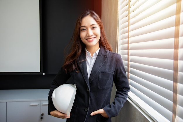 Professional Asian female engineer Standing confidently smiling in the office