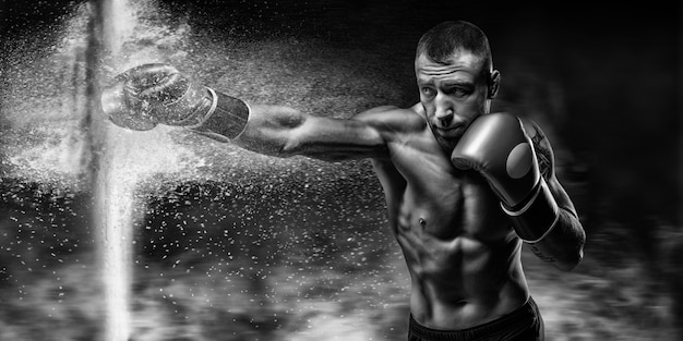 Professional boxer breaks the barrier with a glove. Dust and debris spilled over. 3d rendering. Sports concept. Mixed media