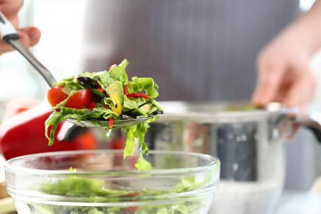 Professional Chef Putting Healthy Vegetable Salad