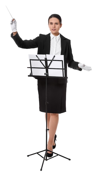 Professional conductor with baton and note stand on white background