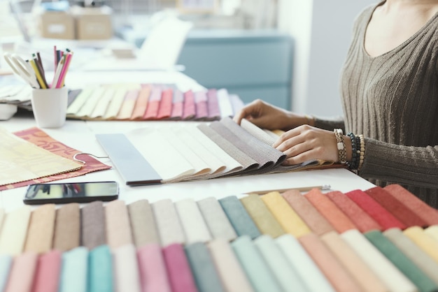 Professional decorator picking fabric swatches