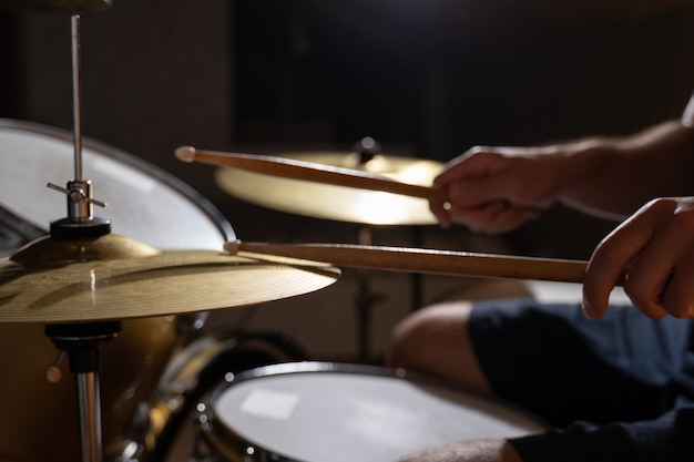 Professional drummer playing on drum set