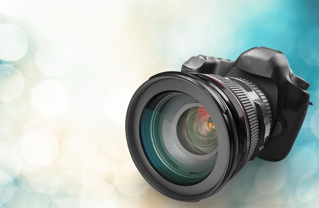 Professional dslr camera on blurred background