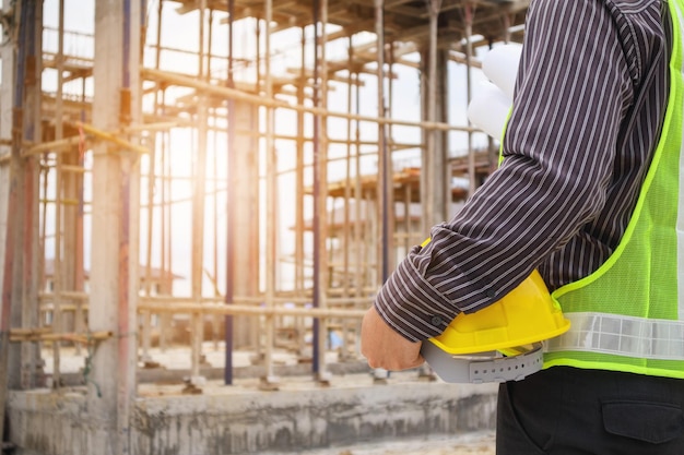 Professional engineer worker at the house building construction site