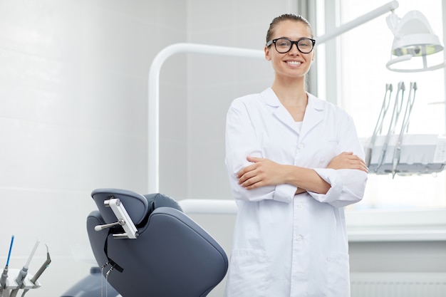 Professional Female Dentist Posing in Office