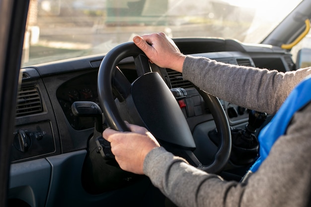 Professional female driver with van or wagon car