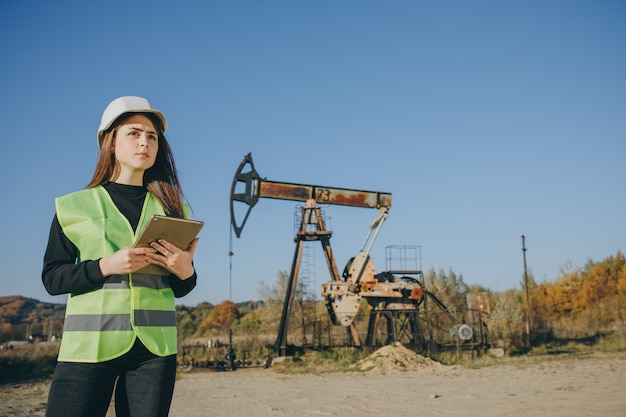 Professional Female Engineer Wearing Safety Uniform and Hard Hat