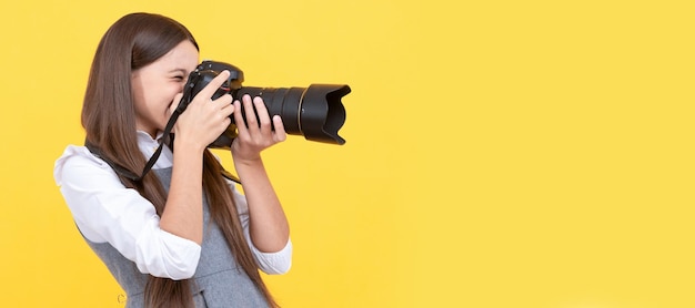 Professional happy child photographing school of photography hobby or career Child photographer with camera horizontal poster banner with copy space