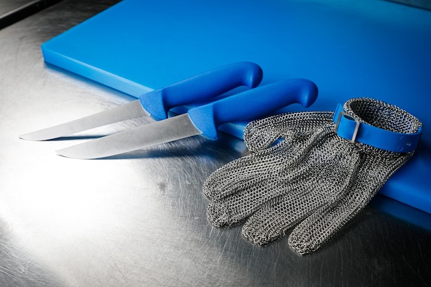 Professional kitchen. Knives, a board on the kitchen table