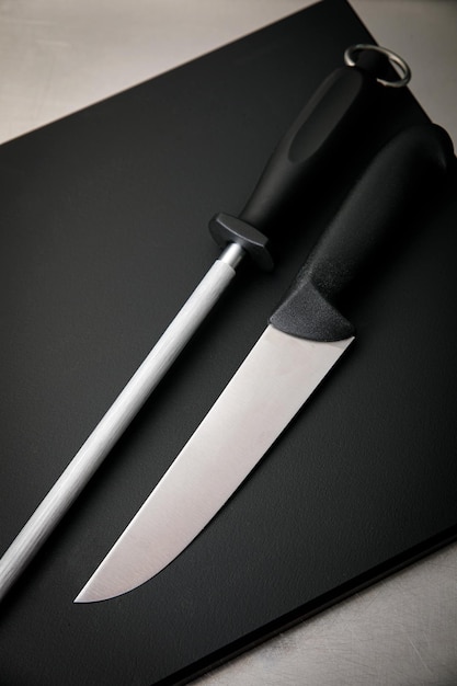 Professional kitchen. Knives, a board on the kitchen table