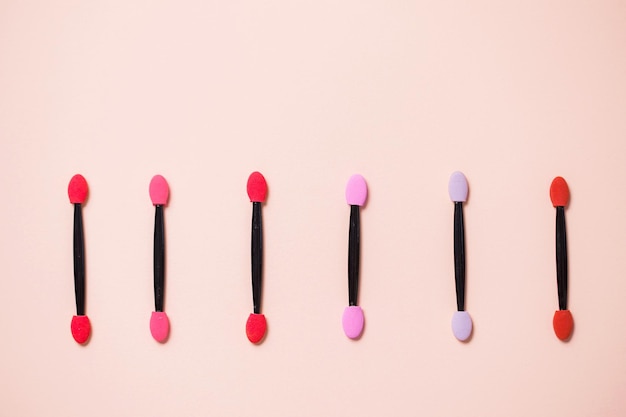 Professional makeup brush on colorful pink background