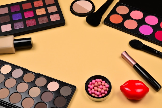 Professional makeup products with cosmetic beauty products, foundation, lipstick,  eye shadows, eye lashes, brushes and tools.