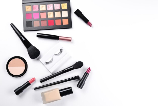 Professional makeup products with cosmetic beauty products foundation lipstick eye shadows eye lashes brushes and tools