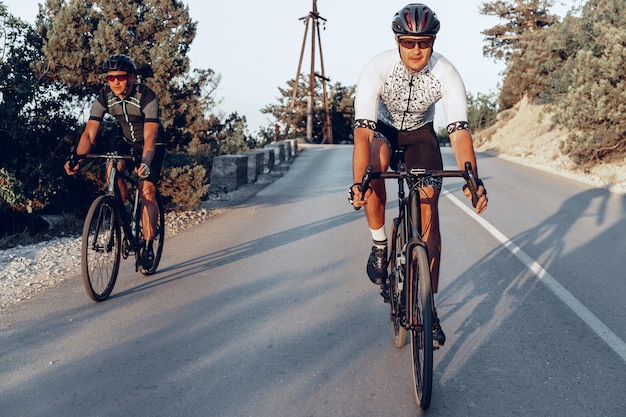 Professional male cyclists riding their racing bicycles