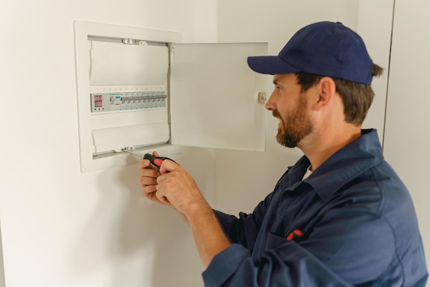 Photo professional male electrician inspect and repairing electrical systems in houses and buildings