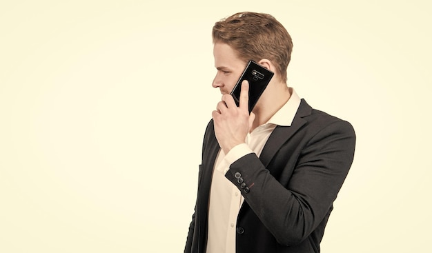 Professional man in business suit talk on mobile phone isolated on white copy space cellphone