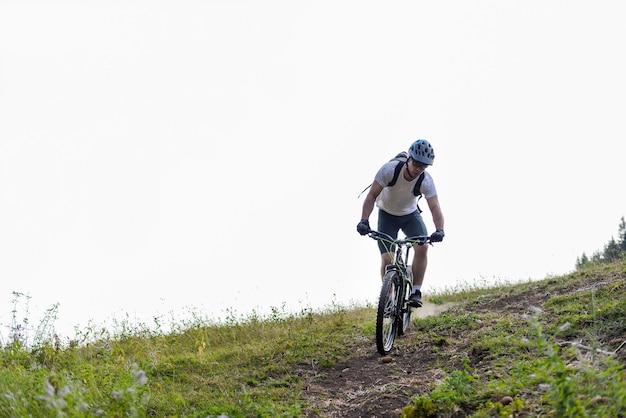 Professional mountain bike cyclist riding downhill