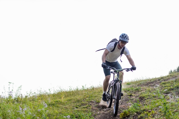 Professional mountain bike cyclist riding downhill