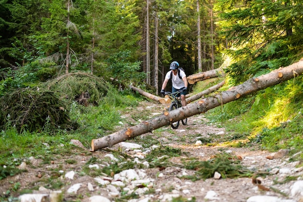 Professional mountain bike cyclist riding a trail in the forest