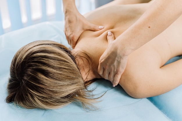 Professional therapeutic massage session for relaxation and muscle relief in a physiotherapy clinic