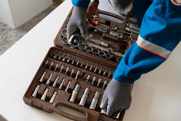 A professional worker taking the instrument tool from the toolbox set