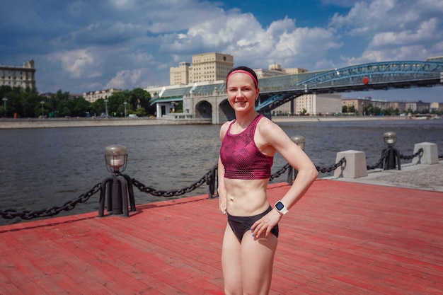 Professional young female runner player running in park for training personal speed and explosive force at holiday weekend The idea and concept of healthy lifestyle in a big city Moscow Gorky Park