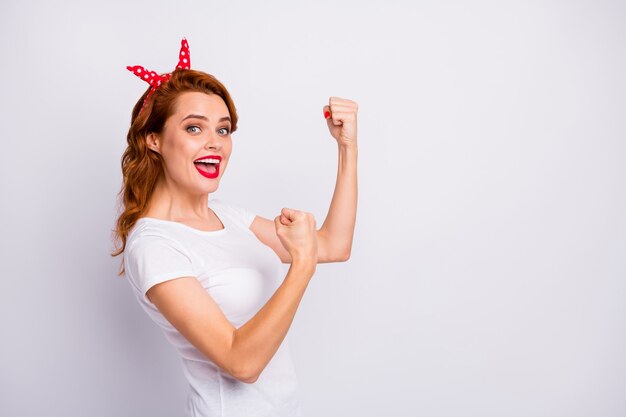 Profile side photo of delighted cheerful woman celebrate sport contest raise fists scream yeah wear good look clothes isolated over white color wall