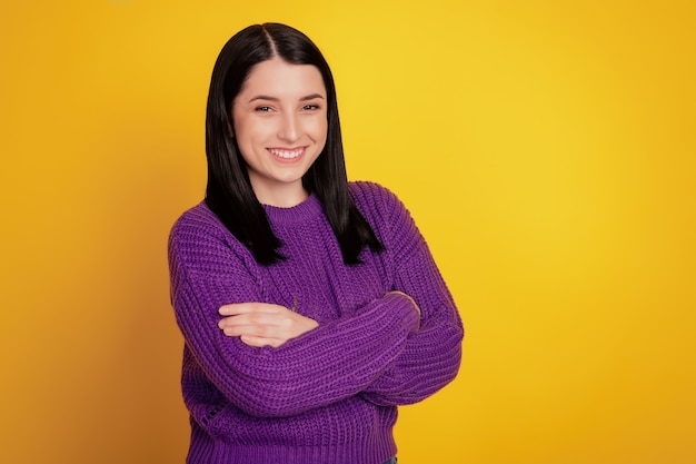 Profile side photo of young cheerful woman happy positive smile crossed hands confident isolated over yellow color background