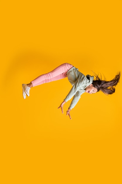 Photo profile vertical photo of pupil flying dream levitate gravity  isolated on bright yellow color background