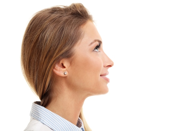 Profile of woman smiling isolated over white background