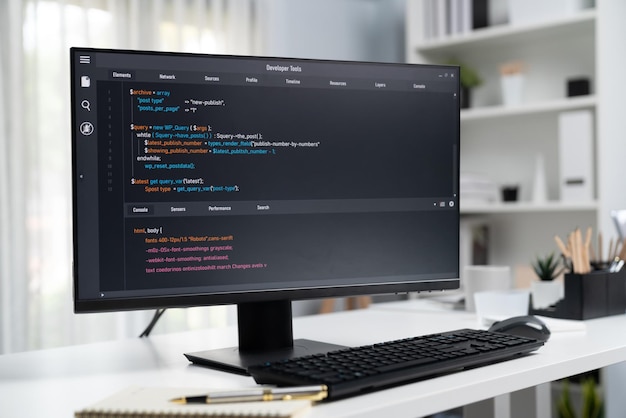 Program coding showing on pc monitor standing on desk working Postulate