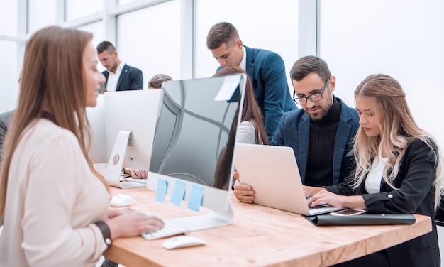 Project Manager and business team sitting at the Desk