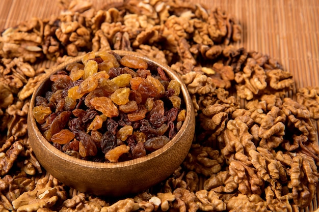 Proper nutrition on the table a cup with raisins and walnuts