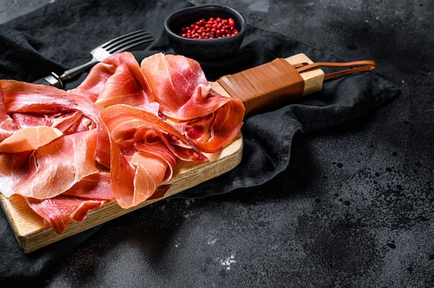 Prosciutto crudo, italian salami, parma ham. Antipasto plate., top view