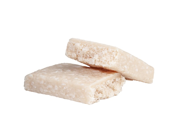 Protein bar with coconut cut into two parts Closeup White background Isolated