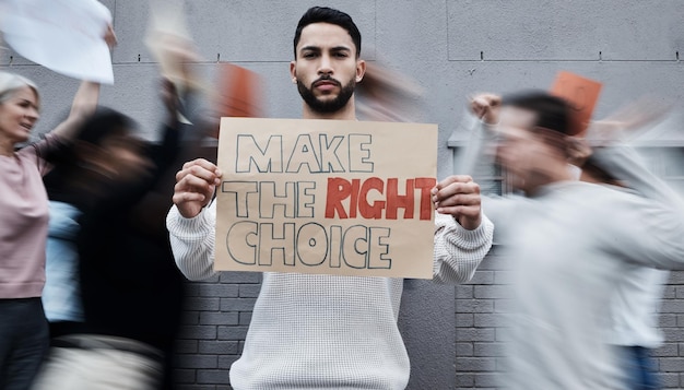 Photo protest poster man and portrait with fight human rights support and rally sign in city urban group and protesting people with a male person holding a pro vaccine movement signage on a street