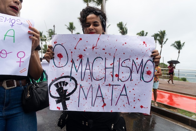 Protesters are seen on Women Day protesting against machismo