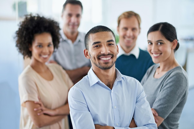 Proud of my teams achievements Portrait of a group of diverse colleagues standing in an office