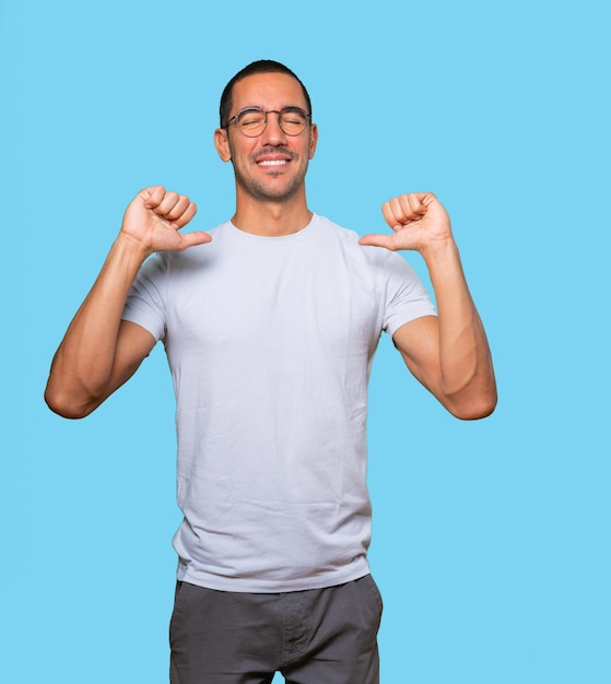 Proud young man making a haughty gesture