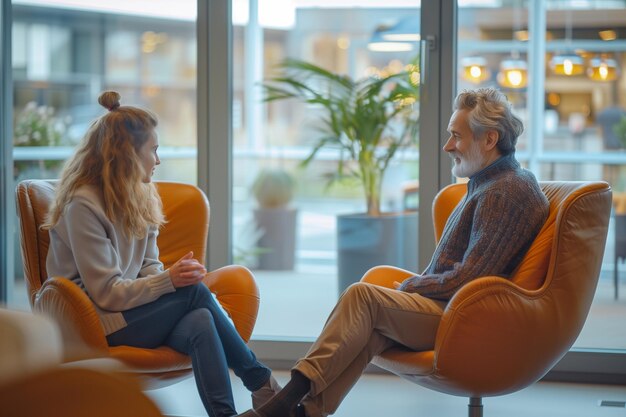 Photo a psychologist and a client engage in a thoughtful discussion within a contemporary therapy office