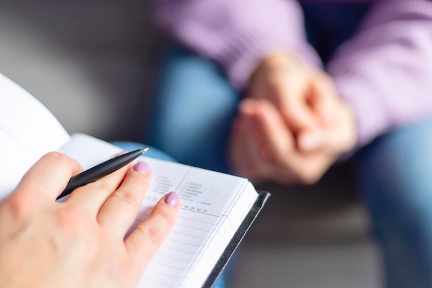 Psychotherapy session a woman is talking with her psychologist at cozy office