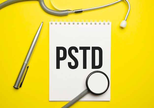 PTSD text written a on paper with a stethoscope Medical concept High quality photo