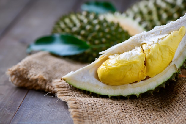 Puangmanee durian on wood plate and wood background It's a small durian v