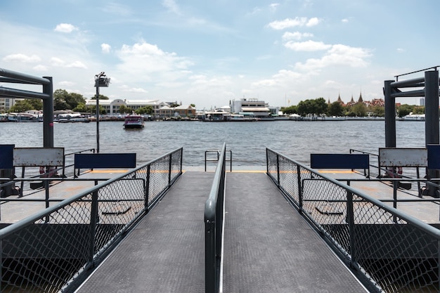 Public boat station on Bangkok Thailand for Passengers getting off the boat docking at river