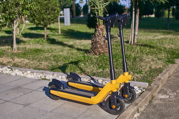 Public parking of electric scooters for eco friendly fast mobile active riding through the city