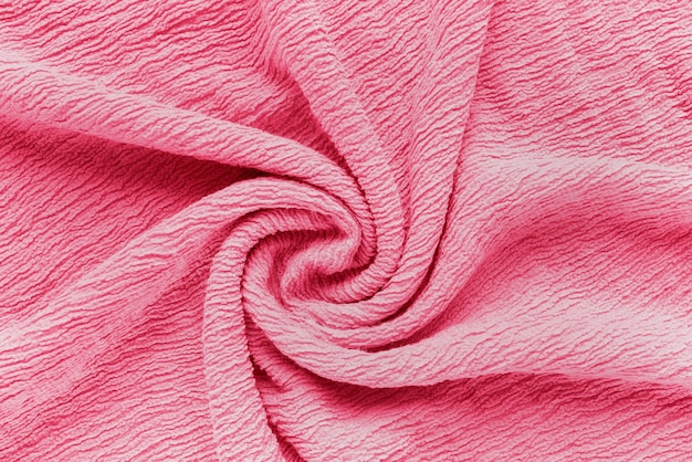 Puckered texture pink fabric Abstract background in trendy color of the year 2023 Viva Magenta